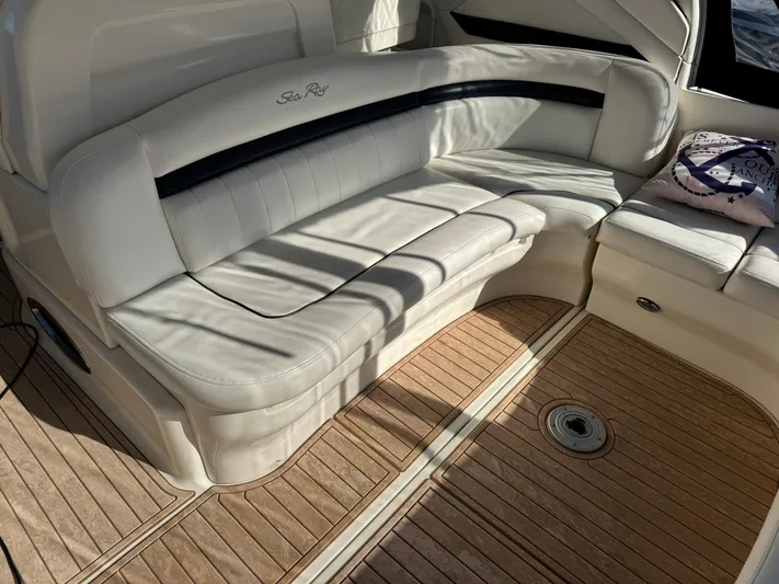  Yacht Photos Pics Luxurious seating on 2004 Sea Ray 390 Sundancer with elegant wood flooring.