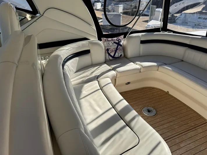  Yacht Photos Pics Luxurious 2004 Sea Ray 390 Sundancer yacht interior with plush white seating and wooden flooring.