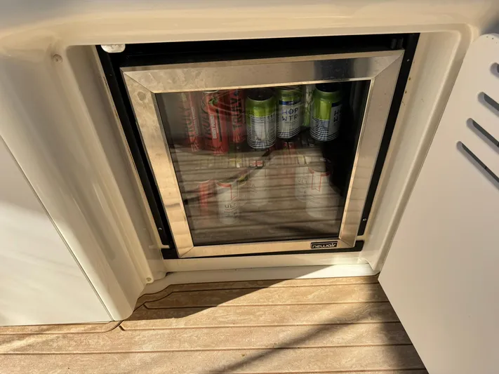  Yacht Photos Pics Mini fridge stocked with beverages on a 2004 Sea Ray 390 Sundancer yacht.