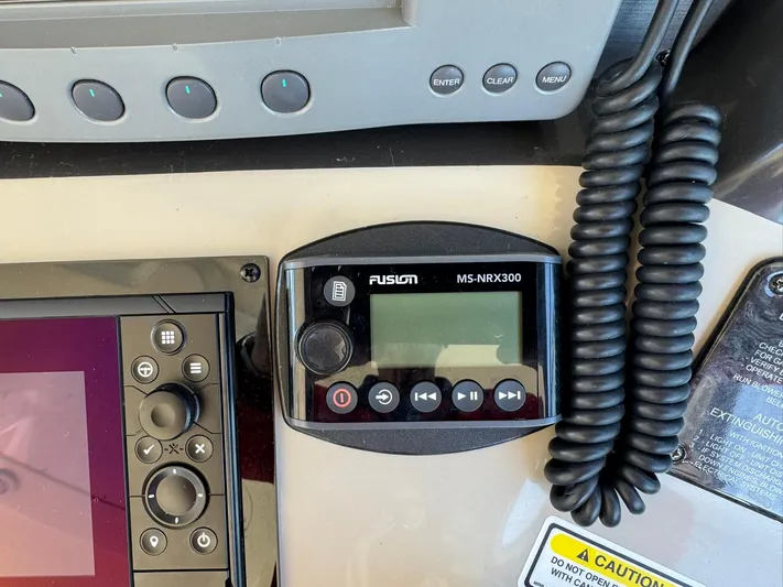  Yacht Photos Pics Control panel of a 2004 Sea Ray 390 Sundancer with Fusion MS-NRX300.