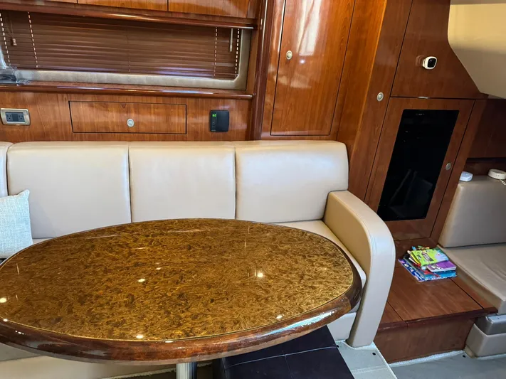  Yacht Photos Pics Interior of 2004 Sea Ray 390 Sundancer with elegant wood finish and plush seating.