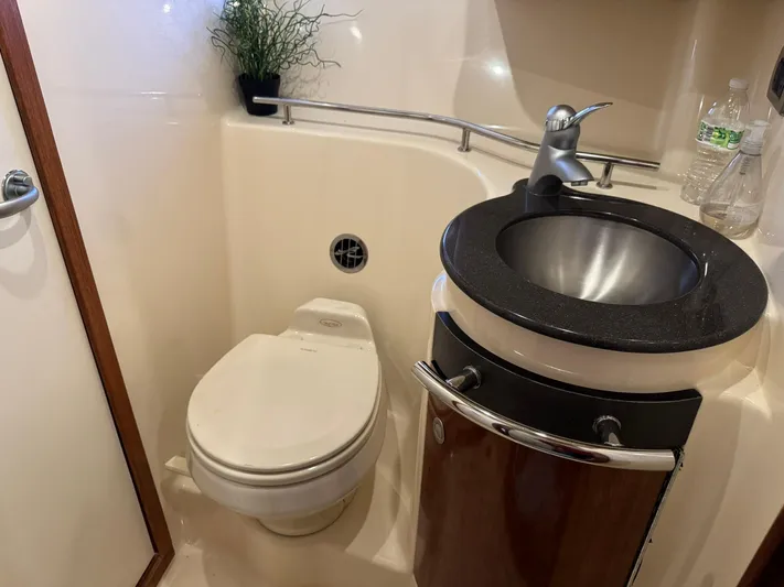  Yacht Photos Pics 2004 Sea Ray 390 Sundancer bathroom with toilet, sink, and modern fixtures.