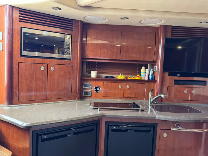  Yacht Photos Pics Luxurious 2004 Sea Ray 390 Sundancer yacht interior with modern kitchen amenities.