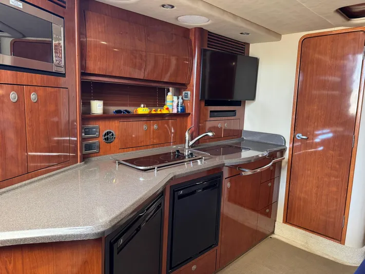  Yacht Photos Pics Luxurious 2004 Sea Ray 390 Sundancer yacht interior with modern kitchen amenities.