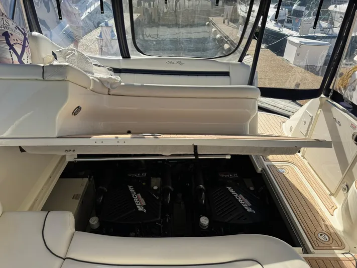  Yacht Photos Pics 2004 Sea Ray 390 Sundancer engine compartment with twin Mercury engines visible.