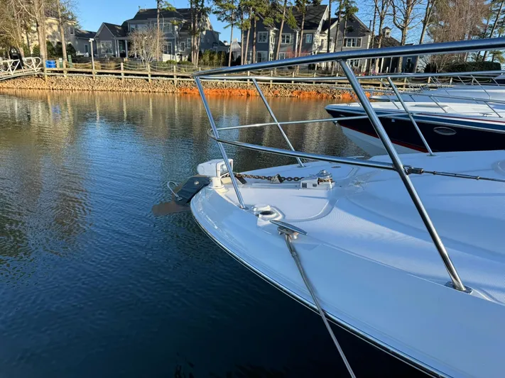  Yacht Photos Pics 2004 Sea Ray 390 Sundancer yacht docked on calm water near waterfront homes.