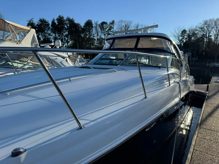  Yacht Photos Pics 2004 Sea Ray 390 Sundancer yacht docked, showcasing sleek design and polished exterior.