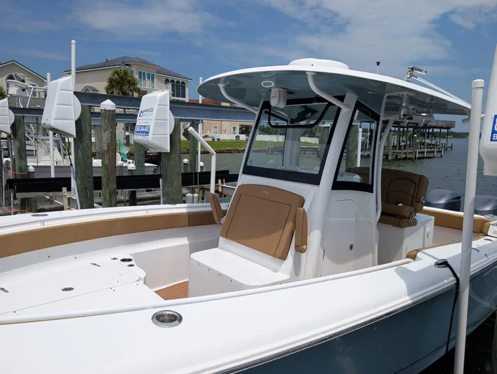 Under Pressure Yacht Photos Pics 2020 Sea Hunt Gamefish 30 boat with forward seating, docked at a marina.