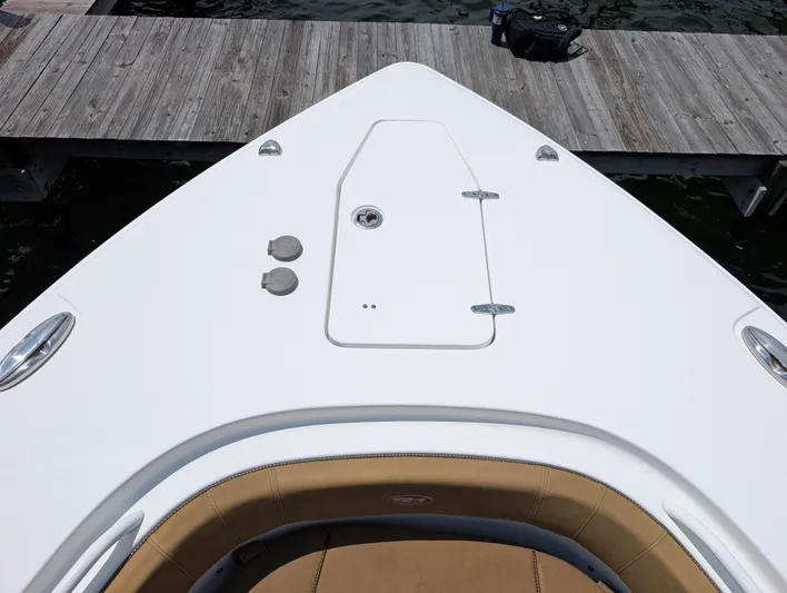 Under Pressure Yacht Photos Pics 2020 Sea Hunt Gamefish 30 Forward Seating boat bow with storage hatch and dock view.