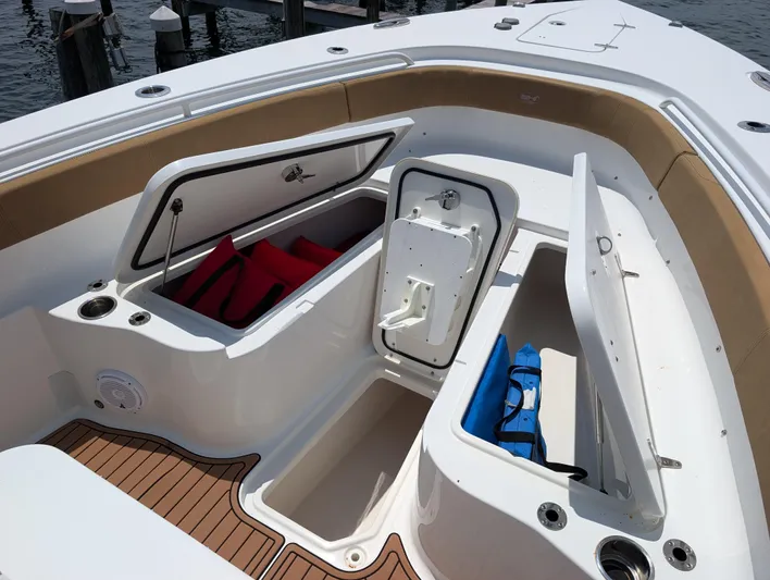 Under Pressure Yacht Photos Pics 2020 Sea Hunt Gamefish 30 Forward Seating with open storage compartments and life jackets.