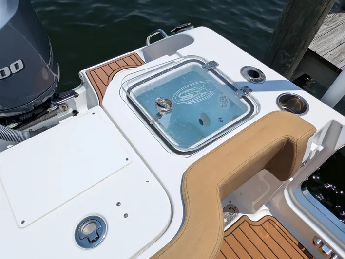 Under Pressure Yacht Photos Pics 2020 Sea Hunt Gamefish 30 boat with forward seating and livewell, docked by water.