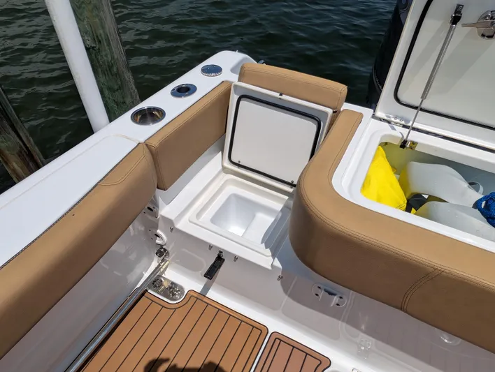 Under Pressure Yacht Photos Pics 2020 Sea Hunt Gamefish 30 boat interior with storage compartments and cushioned seating.