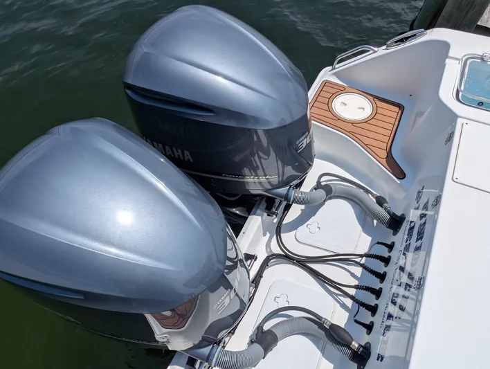Under Pressure Yacht Photos Pics 2020 Sea Hunt Gamefish 30 with dual Yamaha outboard motors, docked on water.