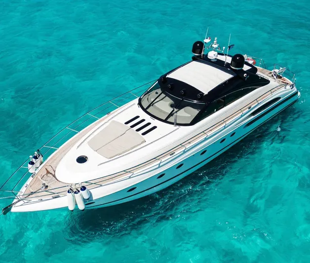 Incentive Yacht Photos Pics Luxury 2004 Princess 65 yacht on clear turquoise water.