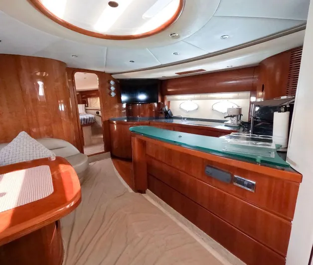 Incentive Yacht Photos Pics Luxurious interior of a 2004 Princess 65 yacht with elegant wood finishes.