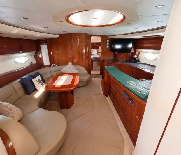 Incentive Yacht Photos Pics Luxurious interior of a 2004 Princess 65 yacht with elegant wood finishes.