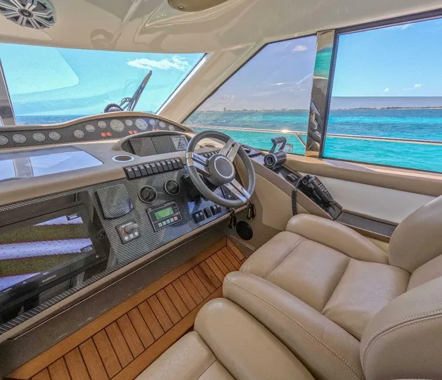 Incentive Yacht Photos Pics Luxurious 2004 Princess 65 yacht cockpit with ocean view and modern controls.