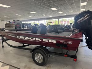 2025 Tracker Pro Team 175 boat in showroom with Mercury engine.