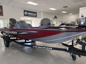 2025 Tracker Pro Team 175 boat in showroom, featuring red and gray design.