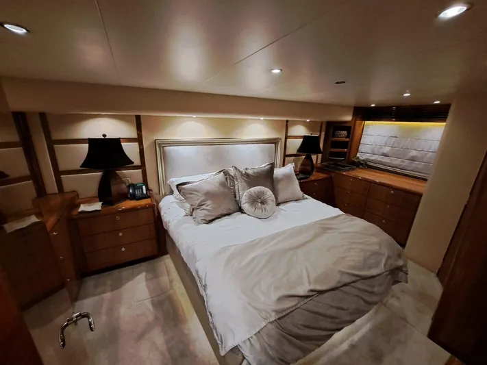 Mary Rose Yacht Photos Pics Luxurious bedroom interior of 2006 Hatteras 68 Convertible yacht with elegant decor.