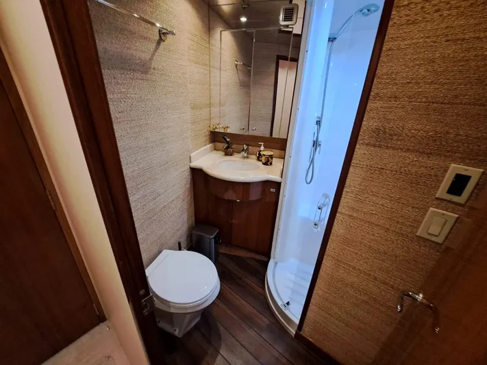 Mary Rose Yacht Photos Pics Luxurious bathroom in 2006 Hatteras 68 Convertible yacht with shower and toilet.