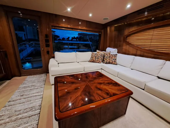 Mary Rose Yacht Photos Pics Luxurious interior of 2006 Hatteras 68 Convertible yacht with elegant wood finishes.