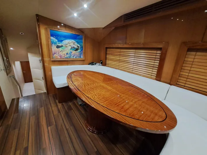 Mary Rose Yacht Photos Pics Luxurious interior of 2006 Hatteras 68 Convertible yacht with elegant wood finishes.
