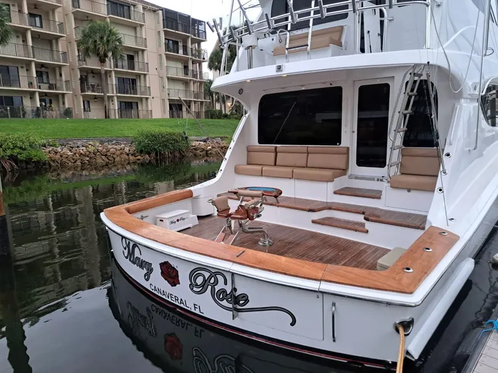 Mary Rose Yacht Photos Pics 2006 Hatteras 68 Convertible yacht docked, featuring spacious deck and seating area.