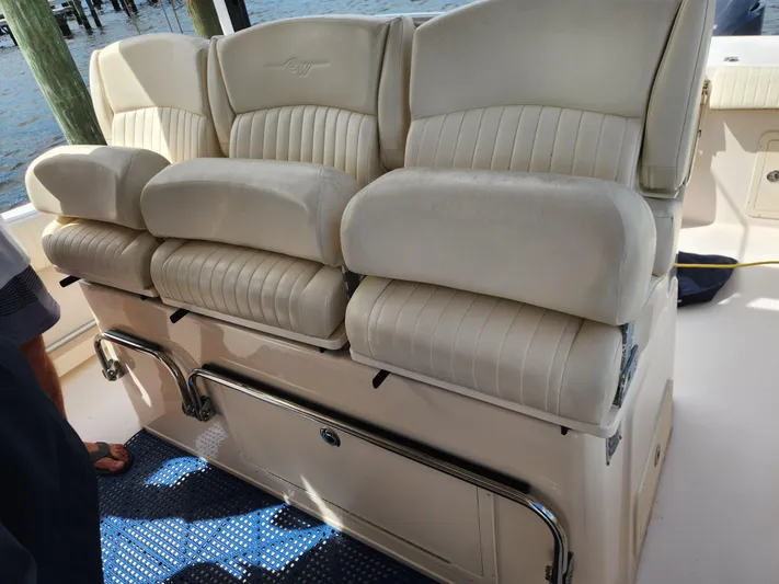  Yacht Photos Pics 2012 Grady-White Canyon 336 boat seating, featuring plush, cream-colored upholstery.