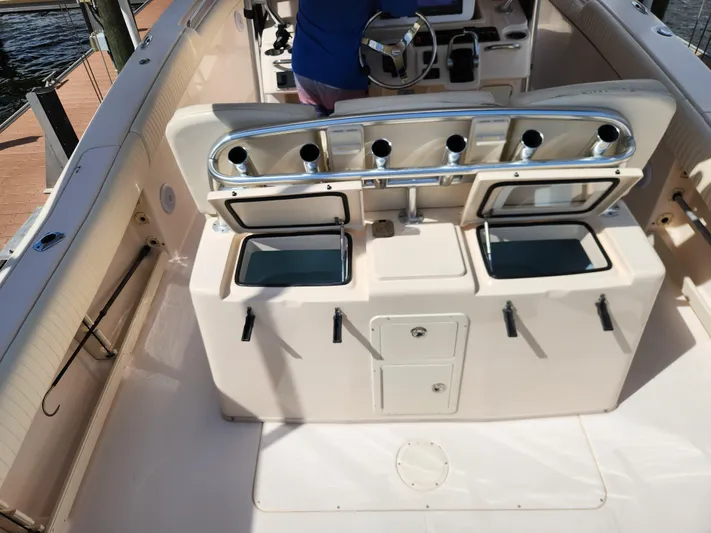 Yacht Photos Pics 2012 Grady-White Canyon 336 boat interior with fishing rod holders and storage compartments.