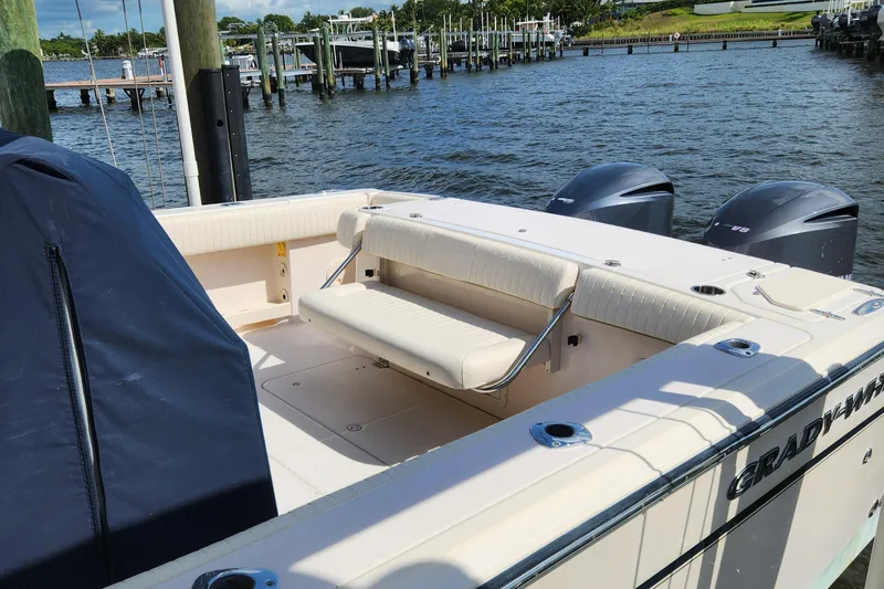  Yacht Photos Pics 2012 Grady-White Canyon 336 boat with dual engines docked by the water.