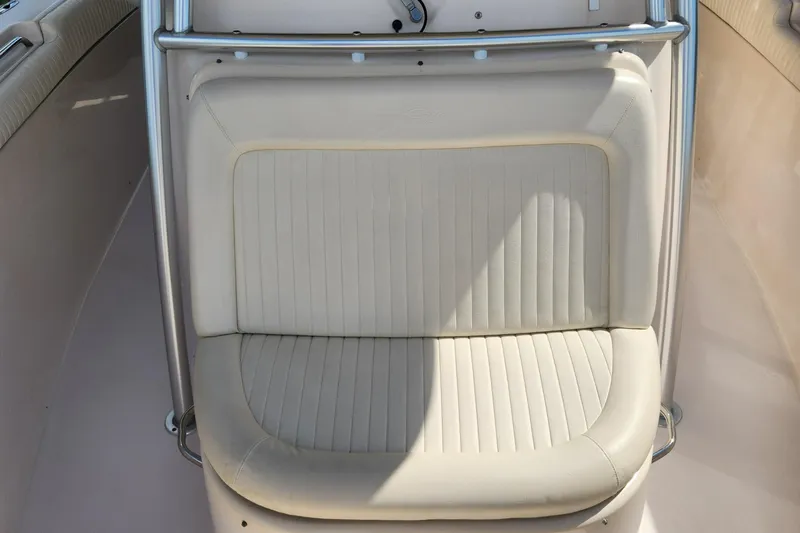  Yacht Photos Pics 2012 Grady-White Canyon 336 boat seat with white upholstery and stainless steel frame.