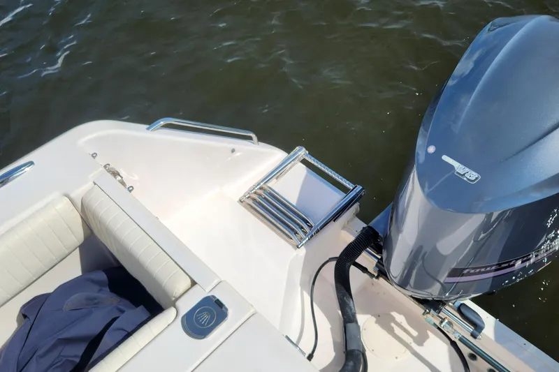  Yacht Photos Pics 2012 Grady-White Canyon 336 boat with V8 engine, ladder, and seating, on water.