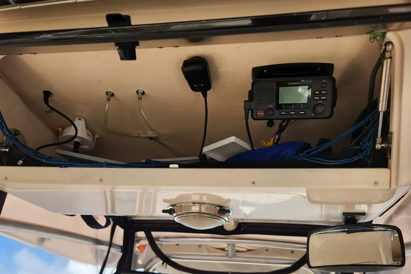  Yacht Photos Pics 2012 Grady-White Canyon 336 boat electronics compartment with Garmin device and wiring.