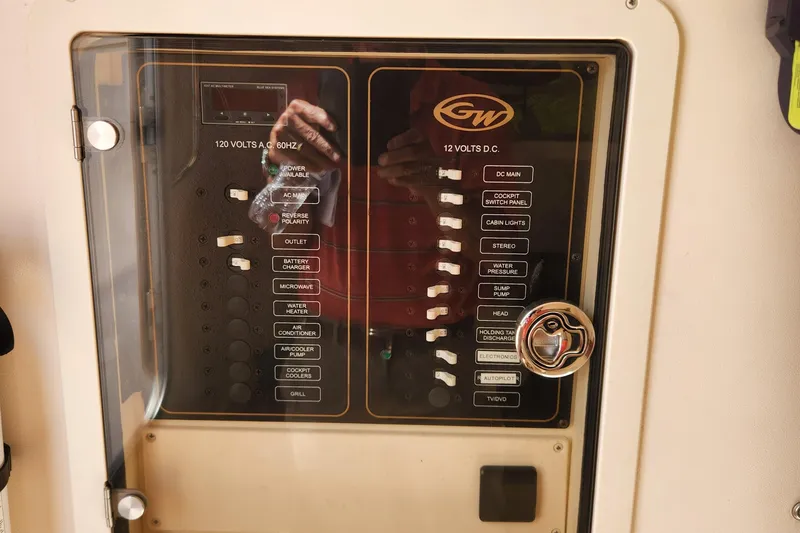  Yacht Photos Pics Control panel of a 2012 Grady-White Canyon 336 boat, featuring various switches and indicators.