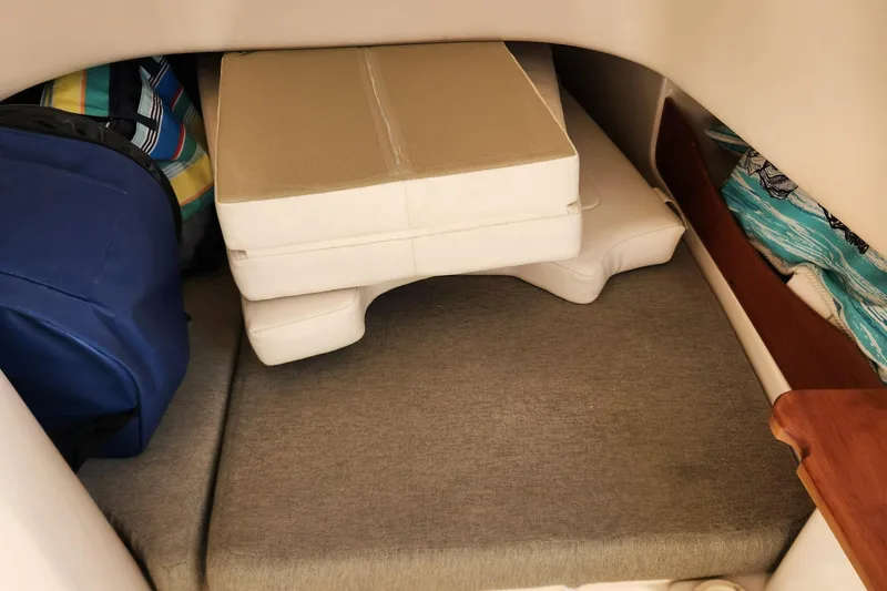  Yacht Photos Pics Interior storage area of 2012 Grady-White Canyon 336 boat with cushions and bags.