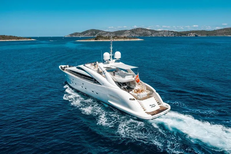  Yacht Photos Pics Luxurious 2008 ISA 120 Sport yacht cruising in clear blue waters.