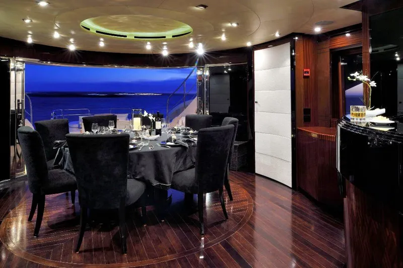  Yacht Photos Pics Luxurious dining area on 2008 ISA 120 Sport yacht with elegant decor and ocean view.