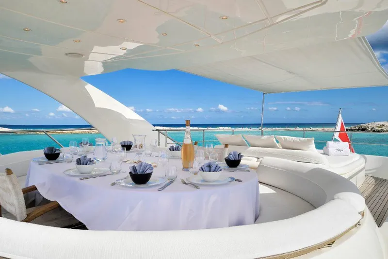  Yacht Photos Pics Luxurious dining setup on 2008 ISA 120 Sport yacht with ocean view.