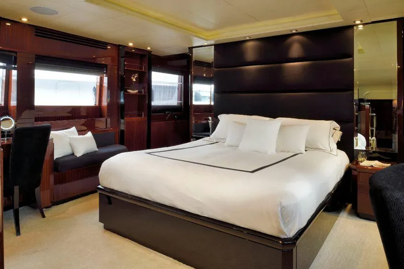  Yacht Photos Pics Luxurious bedroom interior on 2008 ISA 120 Sport yacht, featuring elegant design and plush bedding.