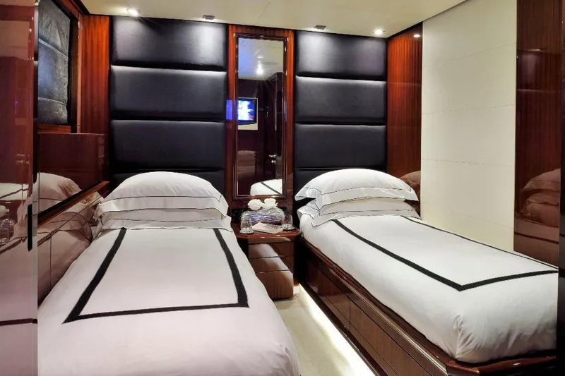  Yacht Photos Pics Luxurious twin bedroom in 2008 ISA 120 Sport yacht, featuring elegant wood paneling.