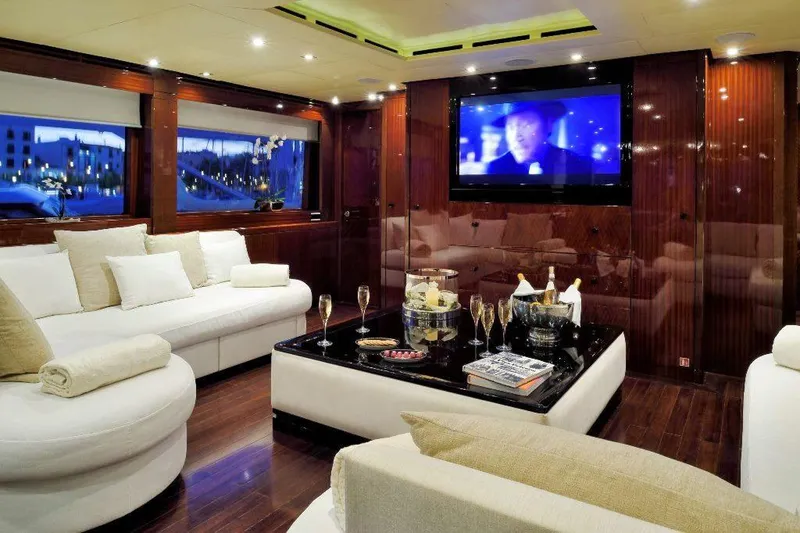  Yacht Photos Pics Luxurious yacht interior with plush seating, champagne, and a large TV screen, ISA 120 Sport 2008.