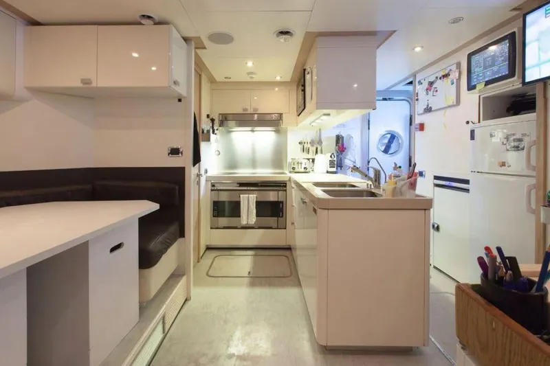  Yacht Photos Pics Modern kitchen interior on 2008 ISA 120 Sport yacht, featuring sleek design and built-in appliances.