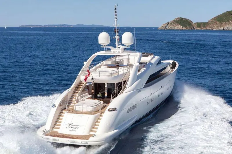  Yacht Photos Pics Luxury yacht ISA 120 Sport 2008 cruising on open sea with scenic island backdrop.