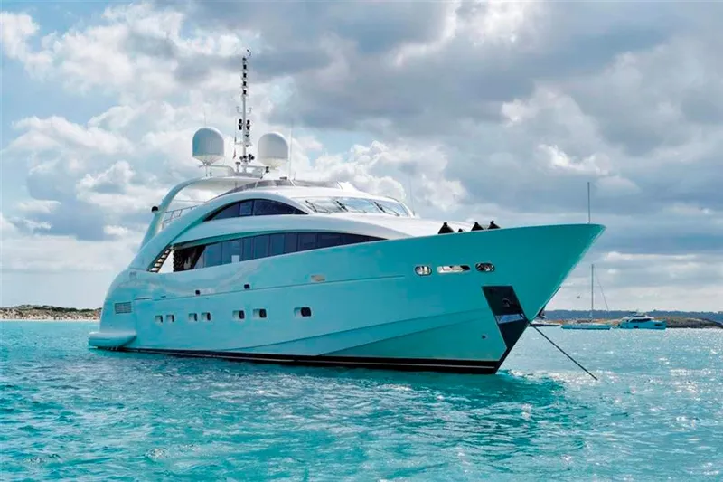  Yacht Photos Pics Luxury yacht ISA 120 Sport 2008 on turquoise water under cloudy sky.