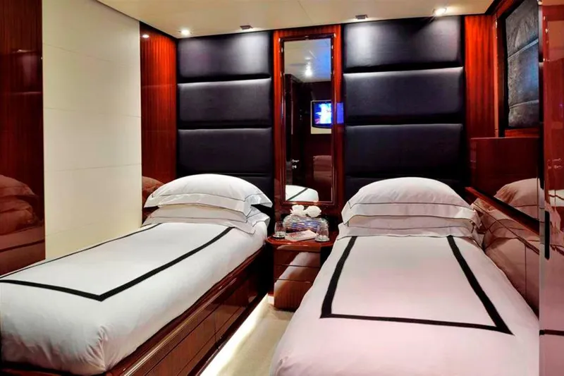  Yacht Photos Pics Luxurious twin bedroom on 2008 ISA 120 Sport yacht with elegant wood paneling.