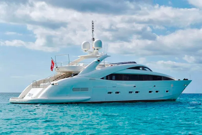  Yacht Photos Pics Luxury ISA 120 Sport yacht from 2008 on clear blue water under a cloudy sky.