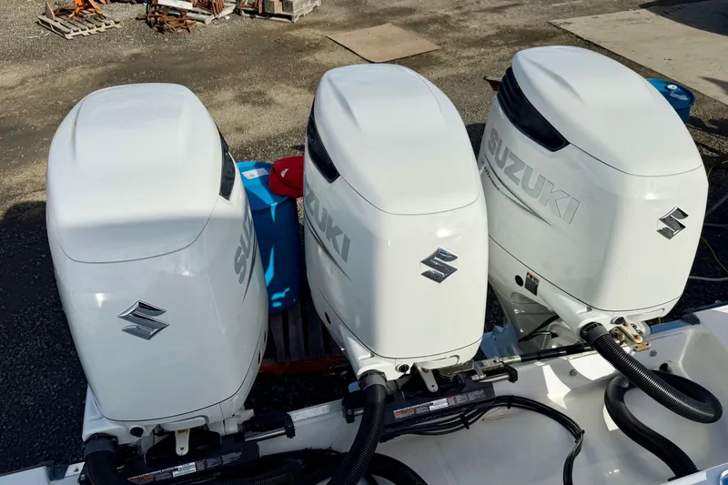 Tilikum Yacht Photos Pics Triple Suzuki outboard motors on a 2008 Hydra-Sports Vector 3500 VX boat.
