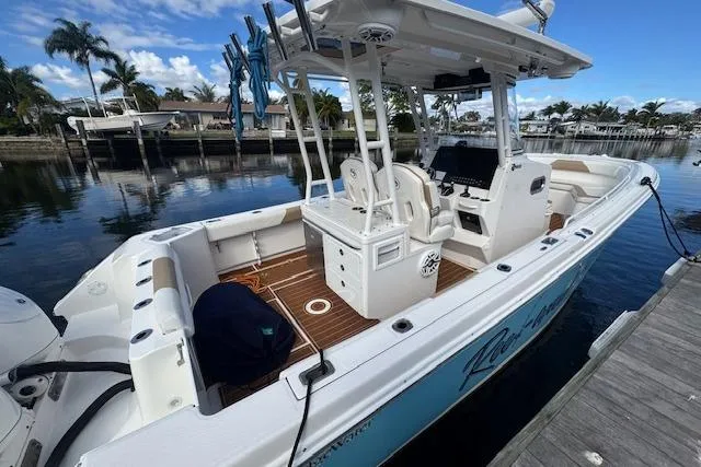  Yacht Photos Pics 2022 Edgewater 280CC boat docked, featuring spacious deck and modern console.