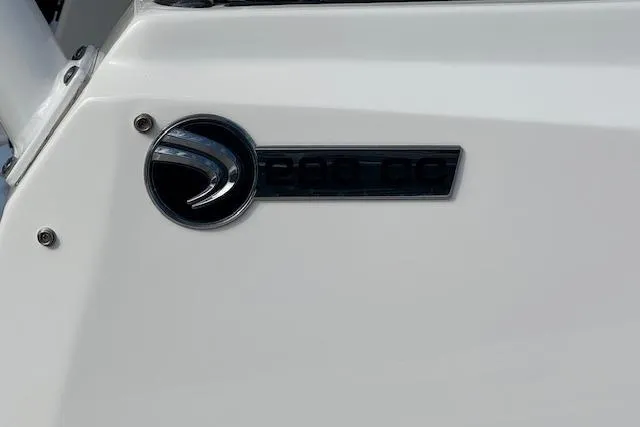  Yacht Photos Pics Edgewater 280CC 2022 model emblem on a sleek white surface.